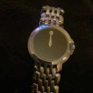Black Movado lady vintage watch. Stealing silver.